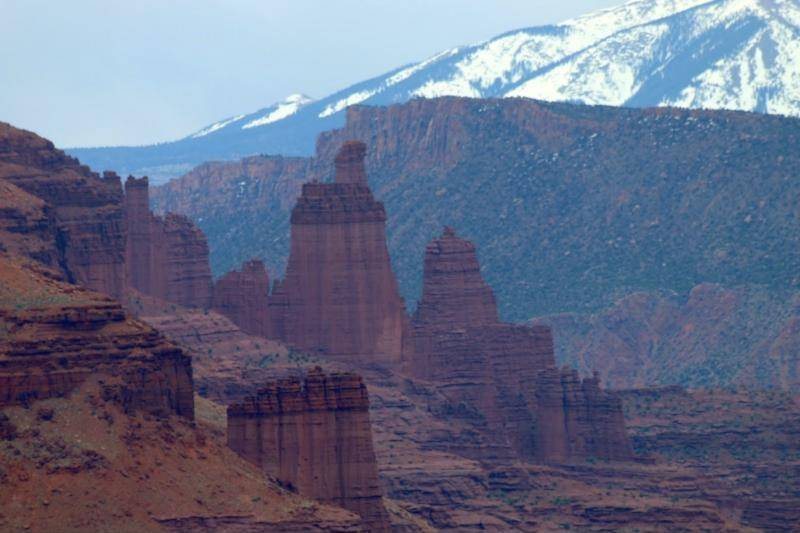 The Fisher Towers in front of the snow-capped La Sal Mountains